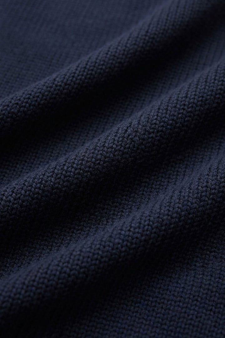 Relaxed navy V-neck sweater full-length view