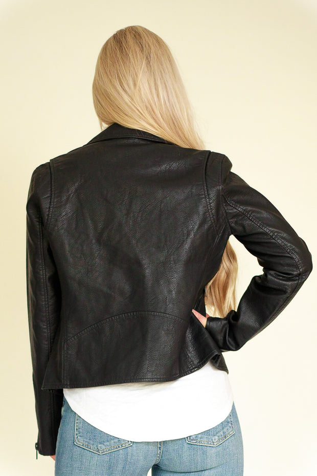 Back view of woman wearing black vegan leather jacket
