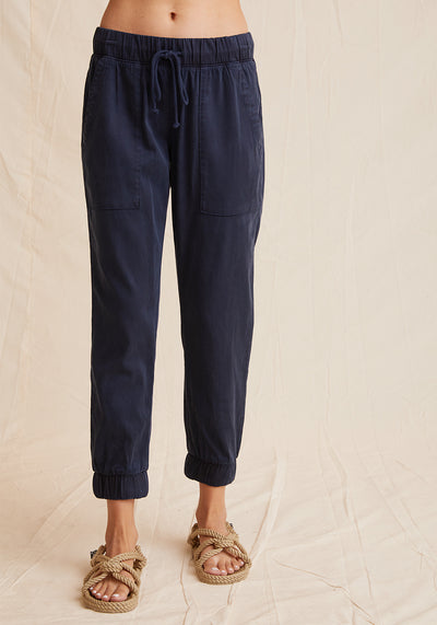 Everyday jogger in navy color with tie waist, cuffed bottoms, and pockets