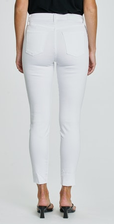 Back view of woman wearing classic mid rise white skinny jeans with raw hem