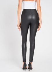 Back view of woman wearing black vegan leather leggings with a glossy texture