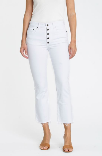 White cropped flare jeans with raw hem and visible button closure